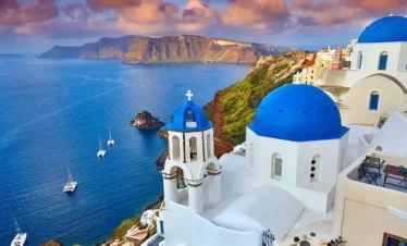 Churches with blue domes in Oia town on Santorini island, Greece