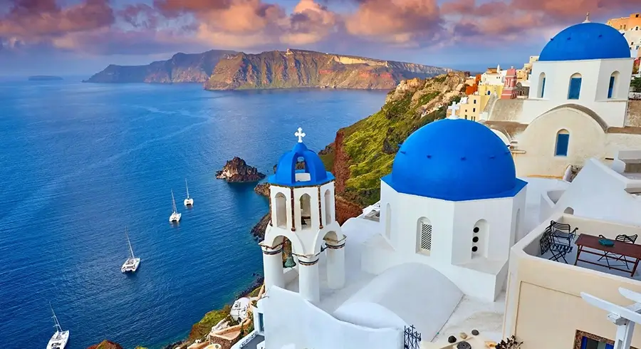 Churches with blue domes in Oia town on Santorini island, Greece